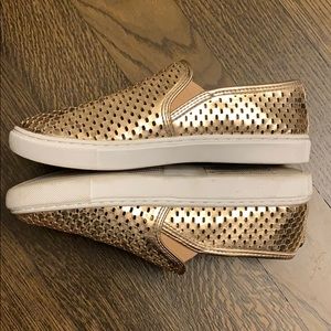 Steve Madden mertalic gold slip on sneakers.
